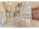 Spacious living room with fireplace and high ceilings at 3804 E Camelback Rd, Phoenix, AZ 85018