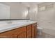 Bathroom featuring a double vanity, a shower over tub, and tile flooring at 42374 W Avella Dr, Maricopa, AZ 85138