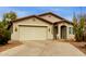 Charming single-story home featuring a two-car garage, desert landscaping, and a neutral stucco exterior at 42374 W Avella Dr, Maricopa, AZ 85138
