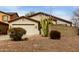 Single-story house featuring desert landscaping and an attached two-car garage at 42374 W Avella Dr, Maricopa, AZ 85138