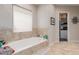 Relaxing bathroom featuring a deep soaking tub and a separate shower at 5023 E Lucia Dr, Cave Creek, AZ 85331