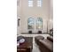 High-ceilinged living room with two arched windows and a piano at 5023 E Lucia Dr, Cave Creek, AZ 85331