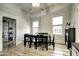Bright dining room features hardwood floors, a table with chairs, and access to the kitchen at 531 E Lynwood St, Phoenix, AZ 85004