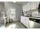 Charming kitchen with white cabinets, wood countertops, and modern appliances at 531 E Lynwood St, Phoenix, AZ 85004