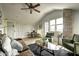 Spacious living room with a leather couch, coffee table, and exposed brick wall at 531 E Lynwood St, Phoenix, AZ 85004