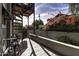 Wood patio with wrought iron furniture and lush greenery at 531 E Lynwood St, Phoenix, AZ 85004