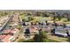 Aerial view of community with houses and a golf course at 563 W Champagne Dr, Chandler, AZ 85248