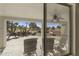 Relaxing backyard patio with seating and golf course view at 563 W Champagne Dr, Chandler, AZ 85248
