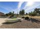 Landscaped backyard with putting green at 563 W Champagne Dr, Chandler, AZ 85248