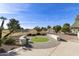 Landscaped backyard with putting green and golf course view at 563 W Champagne Dr, Chandler, AZ 85248