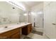 Bathroom with double sinks, shower, and bathtub at 563 W Champagne Dr, Chandler, AZ 85248