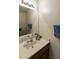 Clean bathroom featuring a vanity, mirror, and toilet at 563 W Champagne Dr, Chandler, AZ 85248
