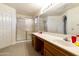Bright bathroom with double sinks and a shower stall at 563 W Champagne Dr, Chandler, AZ 85248