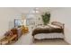 Spacious bedroom with large bed, dresser, and window seat at 563 W Champagne Dr, Chandler, AZ 85248