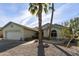 Single-story home with two-car garage and desert landscaping at 563 W Champagne Dr, Chandler, AZ 85248