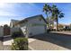 Two-car garage with brick pavers and desert landscaping at 563 W Champagne Dr, Chandler, AZ 85248