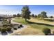 Aerial view of a lush green golf course with manicured lawns and trees at 563 W Champagne Dr, Chandler, AZ 85248