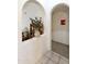 Elegant hallway with decorative vase and arched entryways at 563 W Champagne Dr, Chandler, AZ 85248