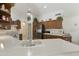 Kitchen features stainless steel appliances and wood cabinets at 563 W Champagne Dr, Chandler, AZ 85248