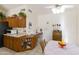 Kitchen features wood cabinets, desk area, and table at 563 W Champagne Dr, Chandler, AZ 85248