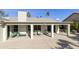 Spacious covered patio with seating area and ceiling fan at 563 W Champagne Dr, Chandler, AZ 85248