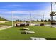 Relaxing patio area with cornhole and seating at 563 W Champagne Dr, Chandler, AZ 85248