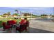 Outdoor patio with seating area, cornhole, overlooking golf course at 563 W Champagne Dr, Chandler, AZ 85248