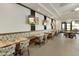 Modern restaurant with booths and multiple TVs at 563 W Champagne Dr, Chandler, AZ 85248