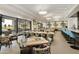 Modern restaurant with tables and chairs, multiple TVs at 563 W Champagne Dr, Chandler, AZ 85248