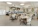 Indoor restaurant with numerous tables and chairs, a bar, and multiple TVs at 563 W Champagne Dr, Chandler, AZ 85248