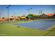 Well-maintained tennis courts with surrounding landscape at 563 W Champagne Dr, Chandler, AZ 85248