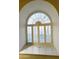 Built-in window seat with arched window and window shutters at 563 W Champagne Dr, Chandler, AZ 85248