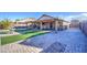 Covered patio, stonework and artificial turf at 7318 W Jones Ave, Phoenix, AZ 85043