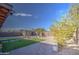 Landscaped backyard with a fountain and fire pit at 7318 W Jones Ave, Phoenix, AZ 85043