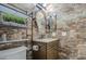 Clean bathroom with tile shower and modern vanity at 7318 W Jones Ave, Phoenix, AZ 85043
