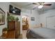Spacious bedroom with ceiling fan and ensuite bathroom at 7318 W Jones Ave, Phoenix, AZ 85043