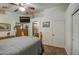 Bright bedroom featuring a ceiling fan and ensuite bathroom access at 7318 W Jones Ave, Phoenix, AZ 85043