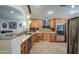 Spacious kitchen with stainless steel appliances and granite countertops at 7318 W Jones Ave, Phoenix, AZ 85043