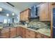 Modern kitchen with granite countertops and stainless steel appliances at 7318 W Jones Ave, Phoenix, AZ 85043