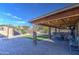 Covered patio with dining furniture and fan at 7318 W Jones Ave, Phoenix, AZ 85043