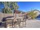 Patio area with wicker barstools and seating at 7318 W Jones Ave, Phoenix, AZ 85043