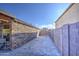 Stone and brick paver walkway between walls at 7318 W Jones Ave, Phoenix, AZ 85043