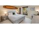 Bright bedroom with a comfortable bed and window seat at 7785 E Luke Ln, Scottsdale, AZ 85250