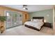 Spacious bedroom with backyard access and ceiling fan at 7785 E Luke Ln, Scottsdale, AZ 85250