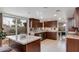 Updated kitchen with island, stainless steel appliances, and backyard access at 7785 E Luke Ln, Scottsdale, AZ 85250