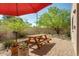 Relaxing patio with seating area and shade umbrella at 7785 E Luke Ln, Scottsdale, AZ 85250