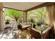 Covered patio with comfortable seating and desert landscaping at 7785 E Luke Ln, Scottsdale, AZ 85250