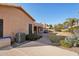 Landscaped backyard with a brick patio and grassy area at 7869 W Kristal Way, Glendale, AZ 85308