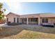 Home exterior showcasing a covered patio and hot tub at 7869 W Kristal Way, Glendale, AZ 85308