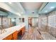 Spacious bathroom with double sinks, a large walk-in shower, and updated fixtures at 7869 W Kristal Way, Glendale, AZ 85308